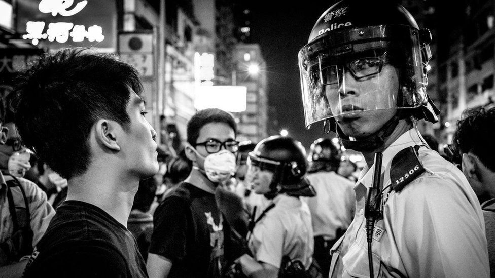 Hong Kong protester and policeman