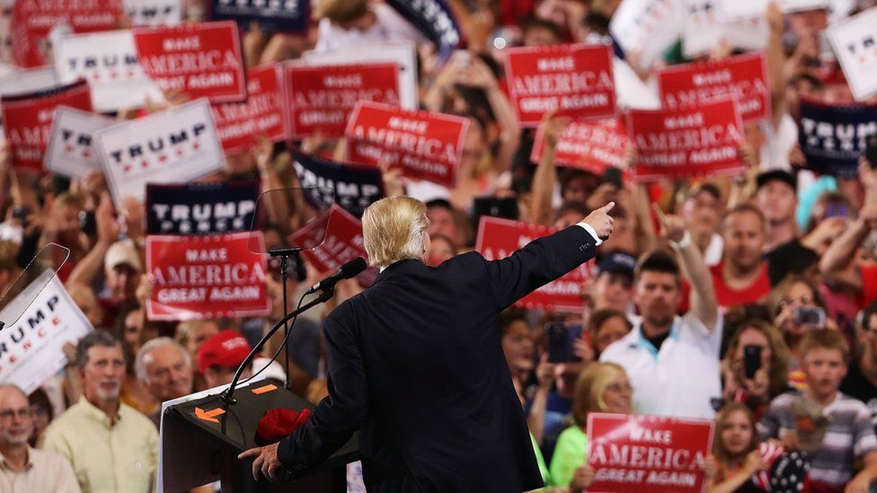 Donald Trump speaks to a large group of supporters at a Florida airport hanger the day after his first debate with Hillary Clinton on September 27, 2016 in Melbourne, Florida