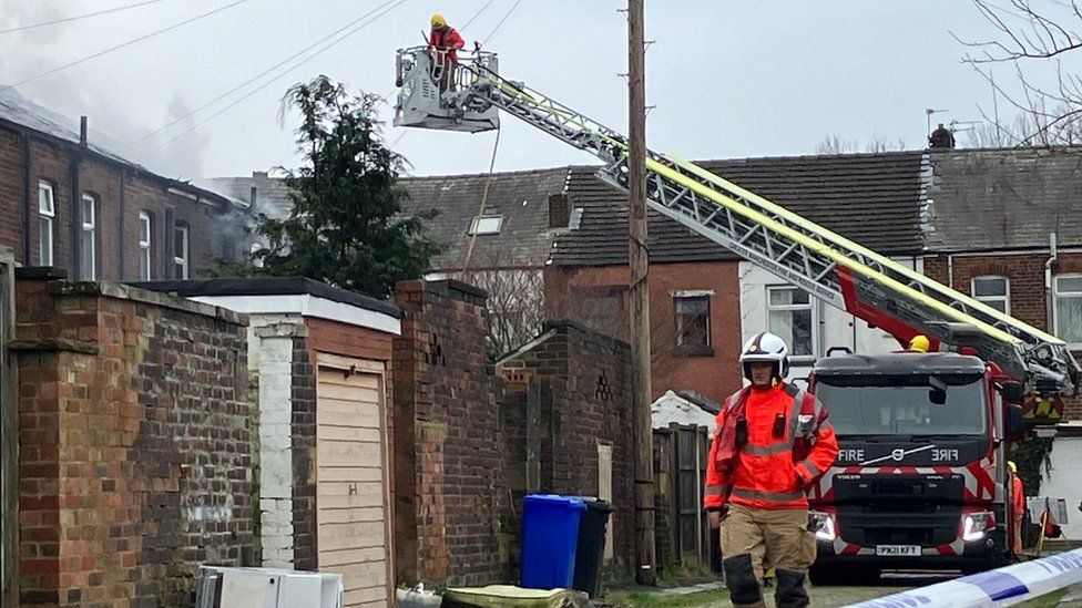 Fire crews tackle blaze after explosion at Bury home