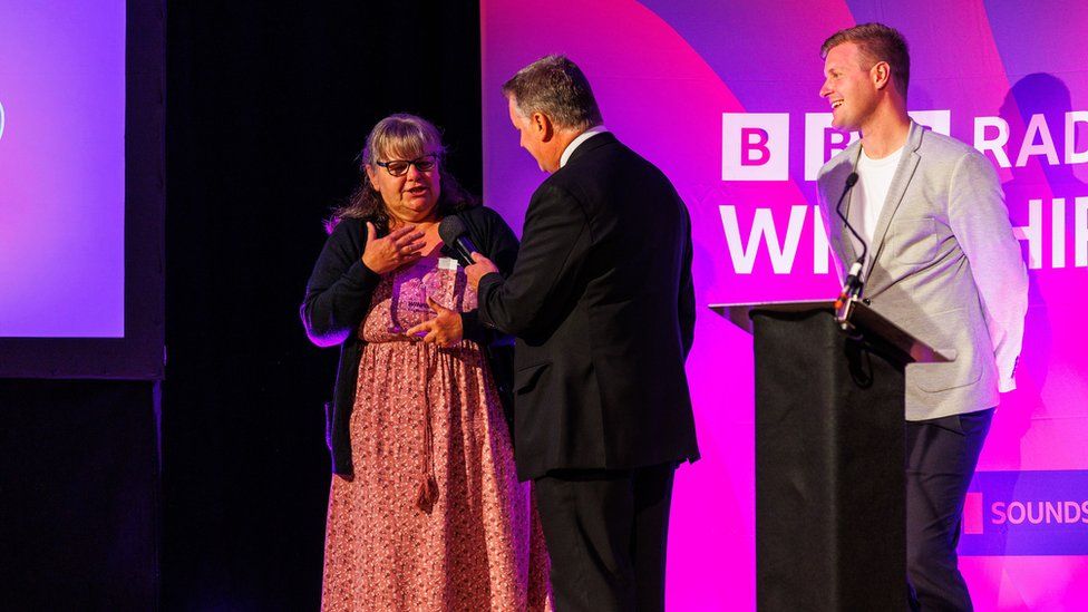 Key worker Karen Whitehouse receives her award