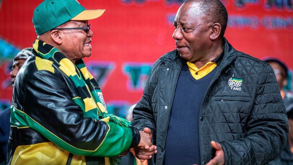 South African President Jacob Zuma (L) and South African Deputy President Cyril Ramaphosa (R) shake hands as they arrive to attend the opening session of the South African ruling party African National Congress (ANC) policy conference on June 30, 2017 in Johannesburg.