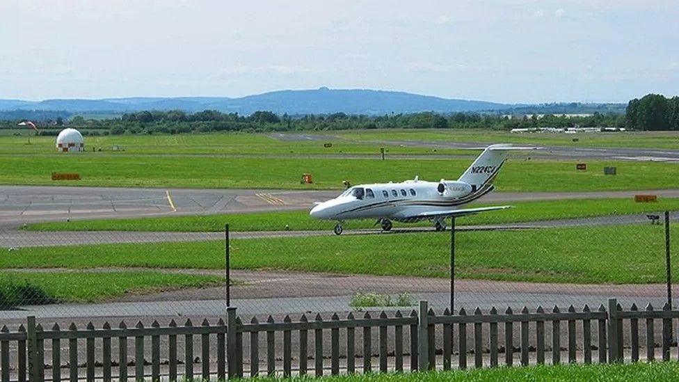 Plane at Gloucestershire Airport on runway