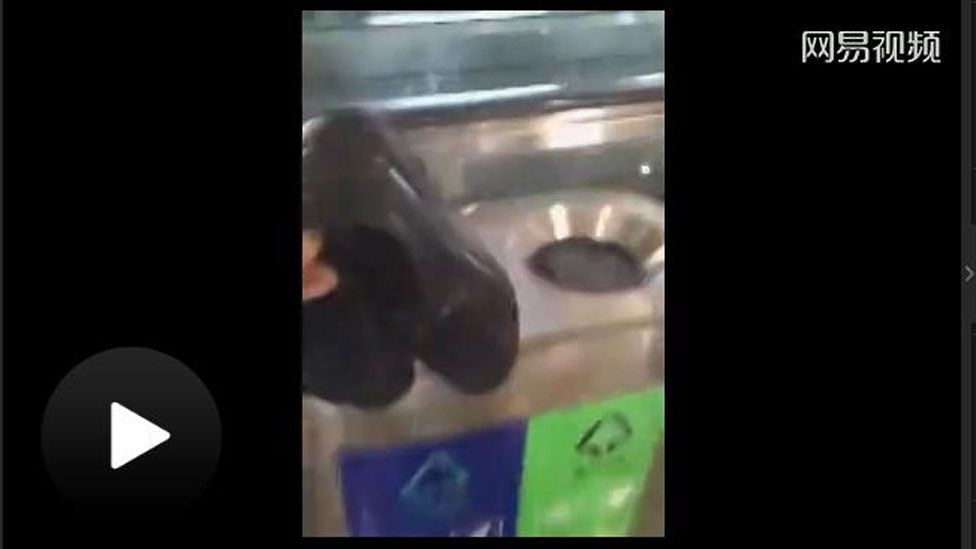 Video showing shoes being thrown in a bin from Chinese web portal NetEase