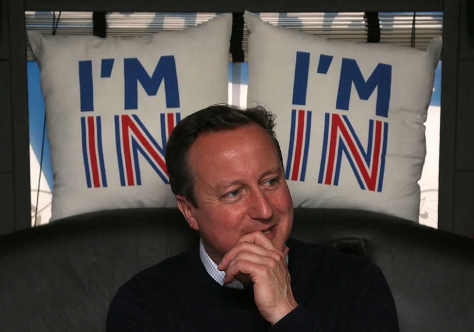 British Prime Minister David Cameron reacts as he travels on his campaign bus from Bristol on June 22, 2016 on the final day of campaigning