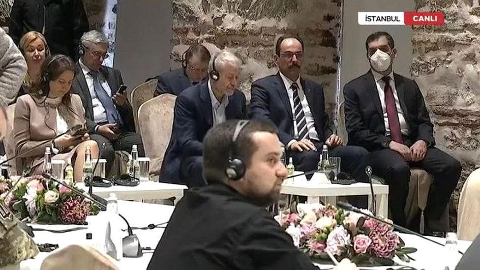 Roman Abramovich is seen sitting at a table alongside Ibrahim Kalin - a spokesman for President Recep Tayyip Erdogan