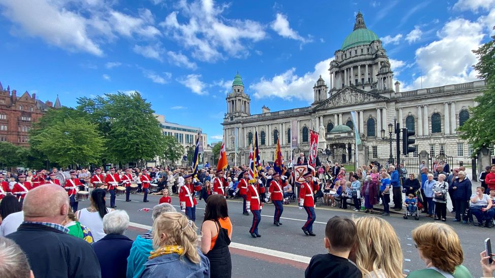 Bands pass by Belfast City Hall