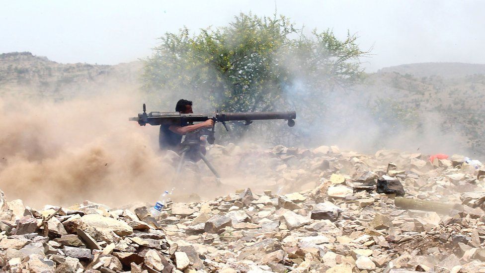 A Yemeni pro-government fighter fires a rocket as Saudi-led forces take over Houthi bases in south-western Yemen, 1 July 2018
