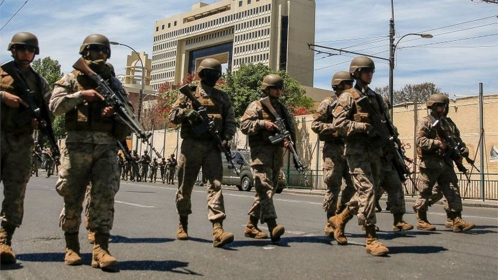 Soldiers take position outside the National Congress building in Valparaiso Chile, on October 22, 2019,