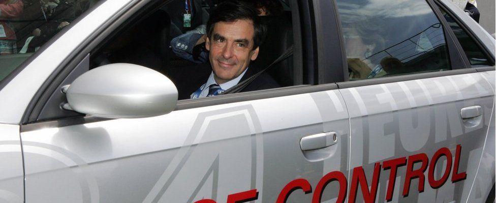 French Prime Minister Francois Fillon drives the Audi RS4 race control car, 16 June 2007 in Le Mans, before the start of Le Mans 24-hour endurance race