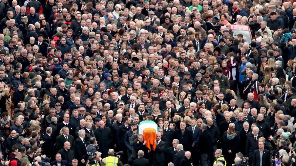 Coffin of Northern Ireland's former deputy first minister and ex-IRA commander Martin McGuinness is carried through the Bogside in Londonderry