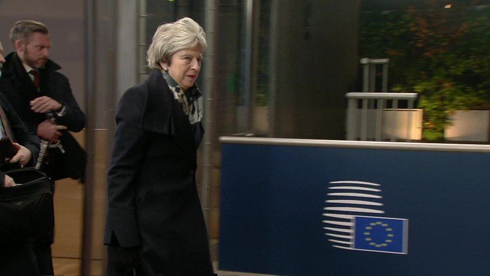 Theresa May leaves the summit