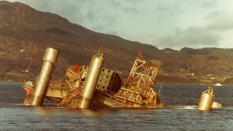 Wreck of a rig in a fjord