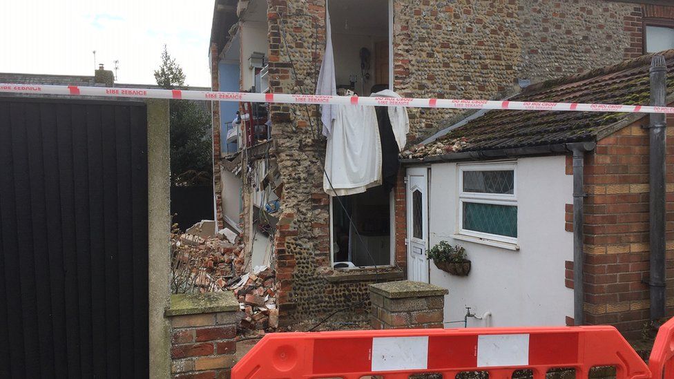 House wall collapsed