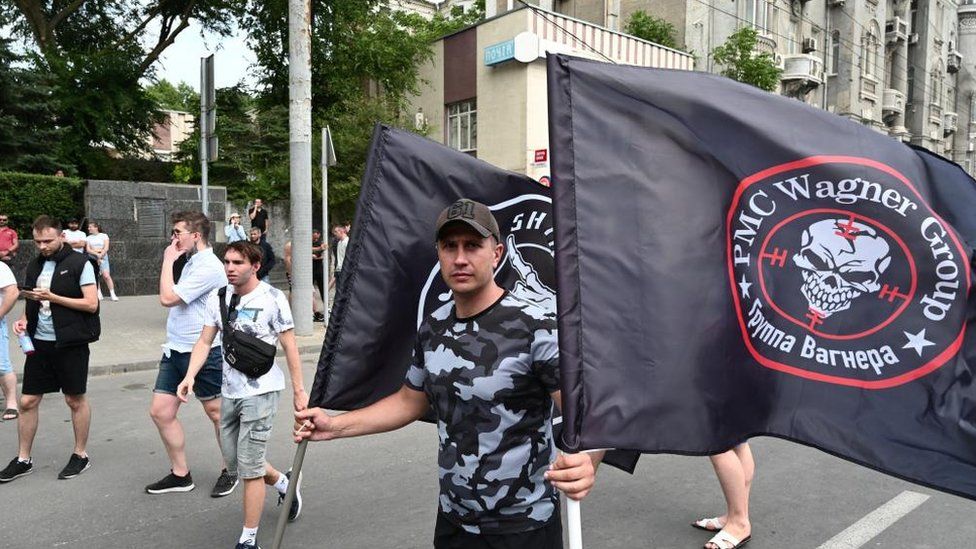 A supporter of Wagner waves flags in Rostov-on-Don