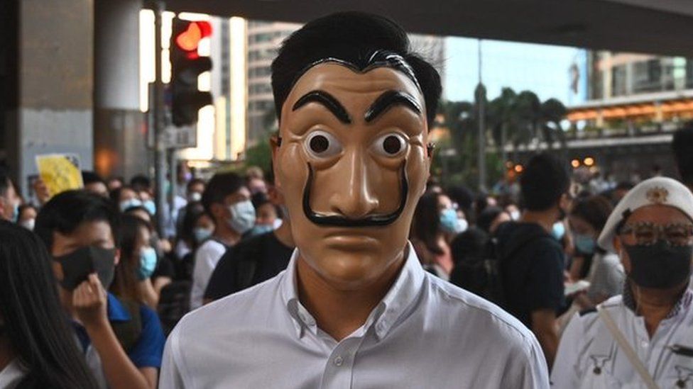 A man wearing a cartoon mask takes part in a protest in the Central district in Hong Kong