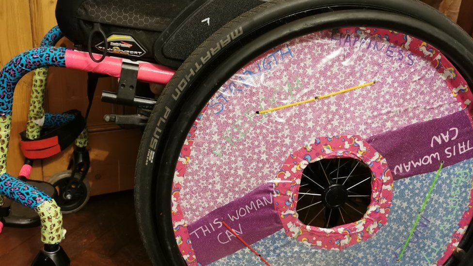 Dr Hann's wheelchair carries the message, 'This woman can'.