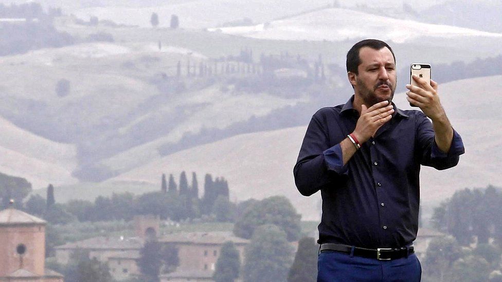 Interior Minister Matteo Salvini poses for a selfie during a visit to an estate which was permanently confiscated in 2007 from the mafia