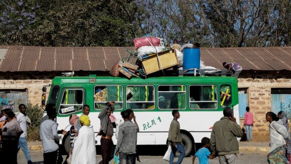 A bus carries displaced people from Tigray.