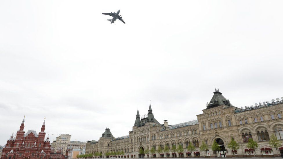 A Russian military plane flies over the Kremlin