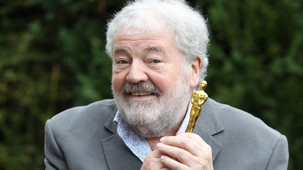 James Martin's father Ivan at home in Belfast with a miniature Oscar statuette