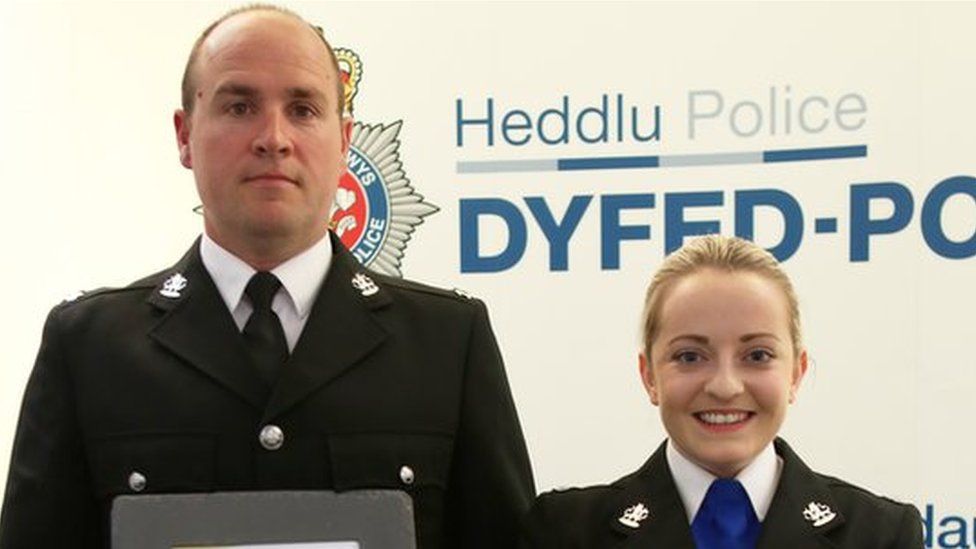PC Nick Allen and PCSO Caryl Griffiths holding bravery awards
