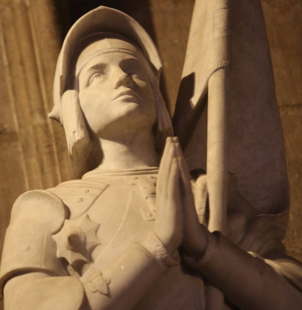 A statue of St Joan of Arc inside Notre-Dame