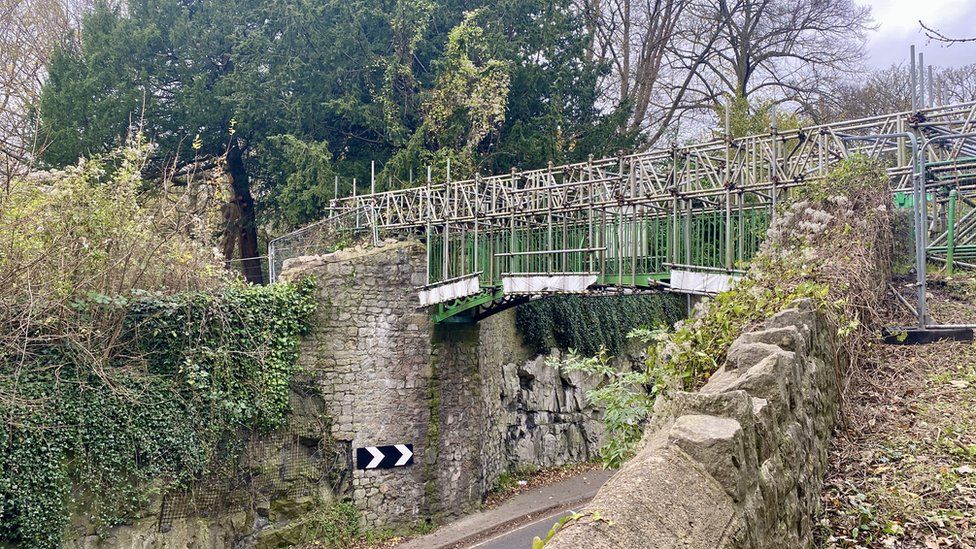 A view of the scaffolding on the bridge showing the road passing underneath