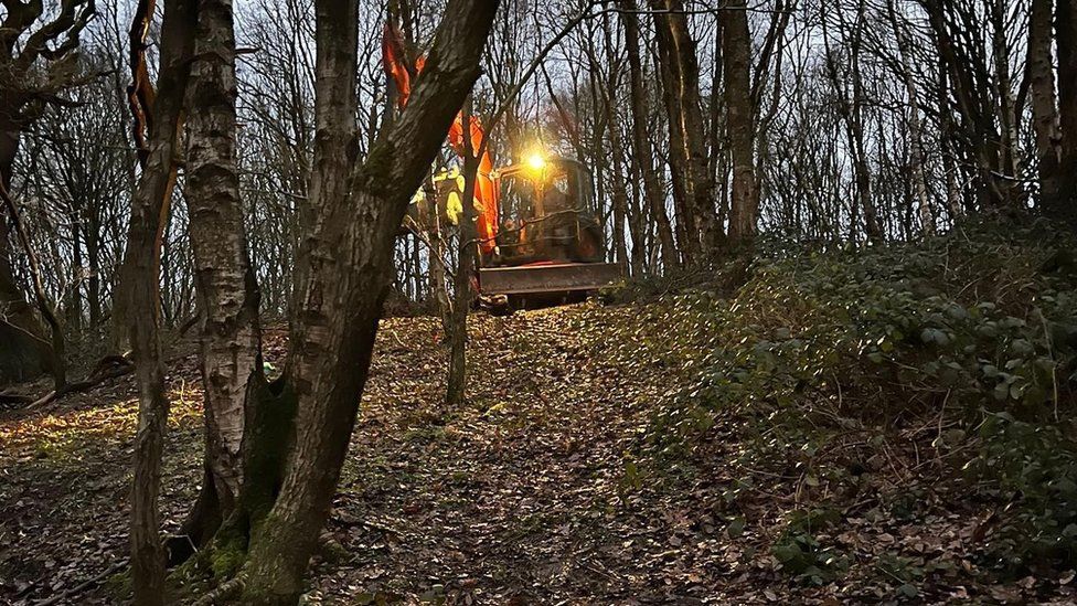 Excavator in the woods in Pudsey, during a dog rescue