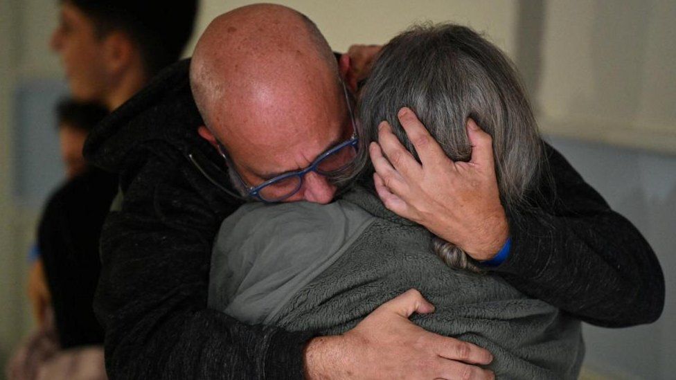 Sharon Avigdori, an Israeli hostage released after being abducted by Hamas, seen hugging her husband