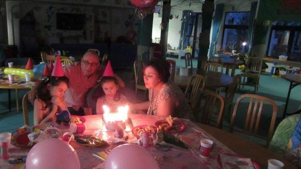 a family enjoying a birthday party at Ty Hafan