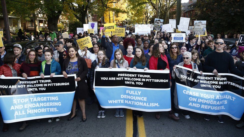 Multiple groups of marchers make their way towards the Tree of Life synagogue three days after a mass shooting in Pittsburgh, Pennsylvania