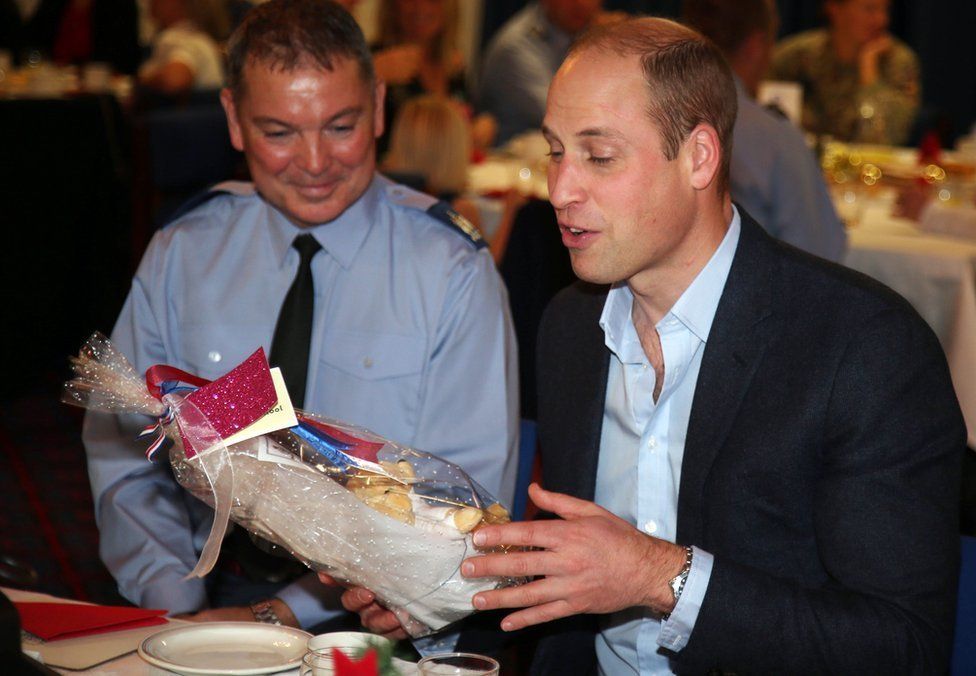 Prince William joins families stationed at RAF Akrotiri base for a Christmas afternoon tea