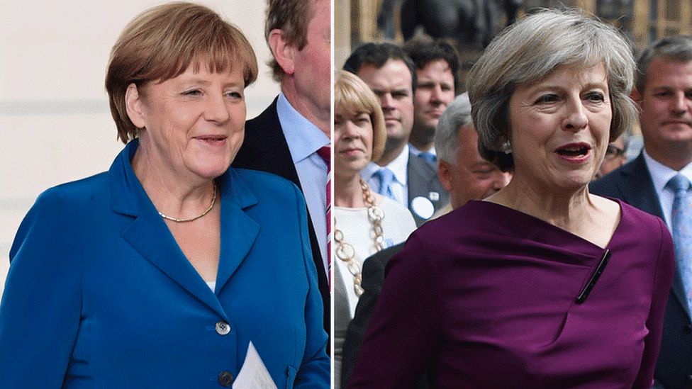 Chancellor Angela Merkel (L) and Conservative leader Theresa May