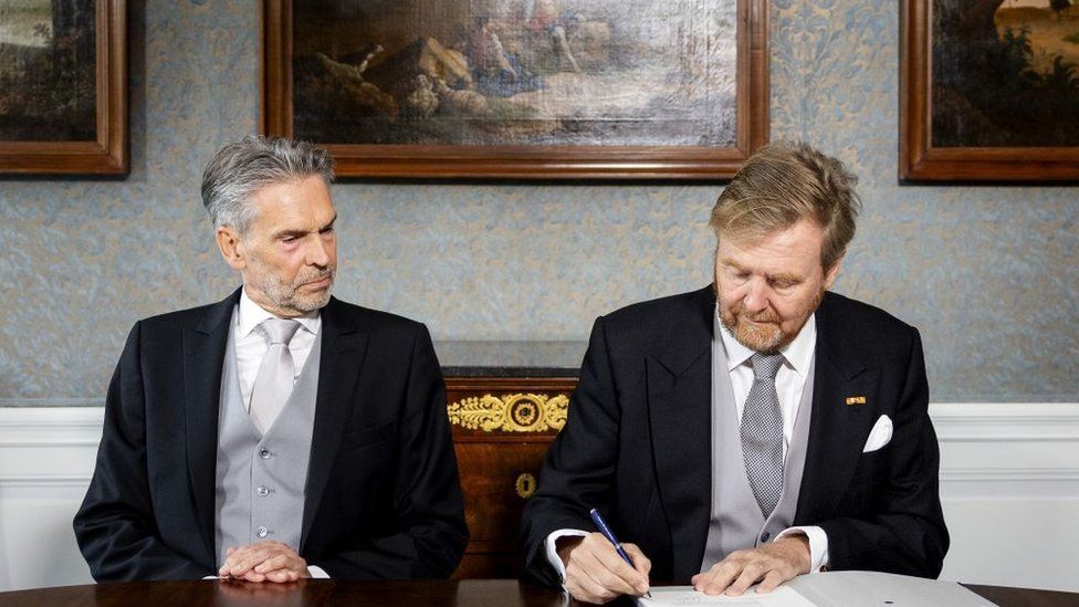 King Willem-Alexander of Netherlands (R) and Dutch Prime Minister Dick Schoof sign the Royal Decrees at Huis ten Bosch Palace in The Hague, on July 2, 2024.