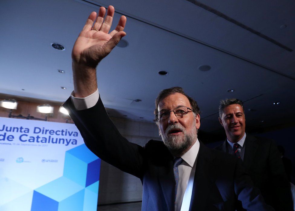 Spanish Prime Minister Mariano Rajoy waves at his arrival to a Catalan regional Popular Party meeting in Barcelona, Spain, 15 September