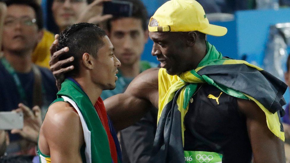 Jamaica's Usain Bolt (R) congratulates South Africa's Wayde van Niekerk - 14 August 2016