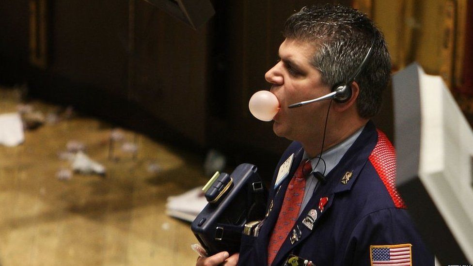trader blowing b ubble gum