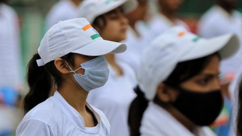 Girls wearing masks take part in India's Independence day celebrations amid COVID-19 coronavirus pandemic in Baramulla Jammu and Kashmir India on 15 August 2022