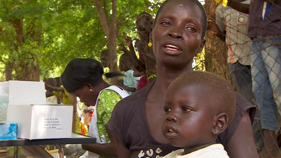 Two year old Taban and his mother after receiving treatment at the open air clinic in Juba