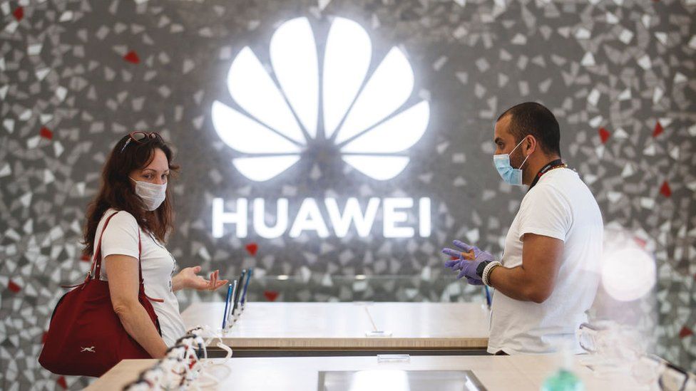 People shop at a Huawei store in Barcelona, Spain