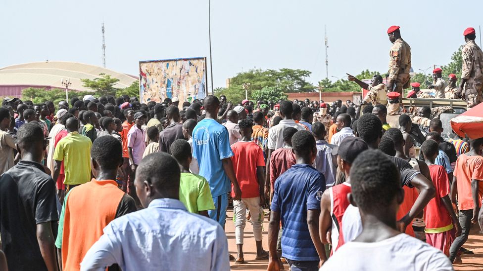 People gather near General Seyni Kountche Stadium in Niamey to join a volenteer force - 19 August 2023