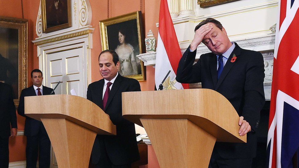 British Prime Minister David Cameron (R) reacts during a joint press conference with Egyptian President Abdel Fattah al-Sisi following their meeting inside 10 Downing Street in central London on November 5, 2015.
