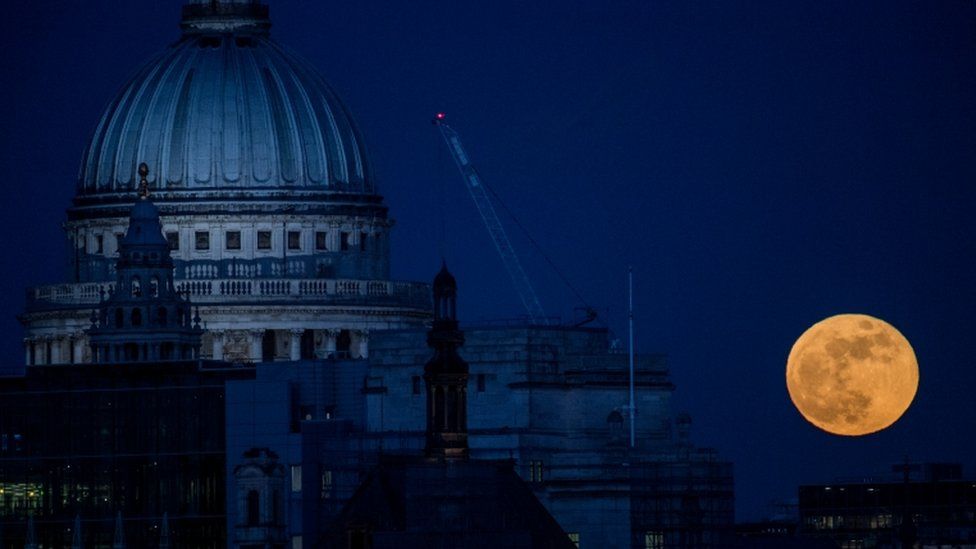 Supermoon rises behind London's St Paul's cathedral