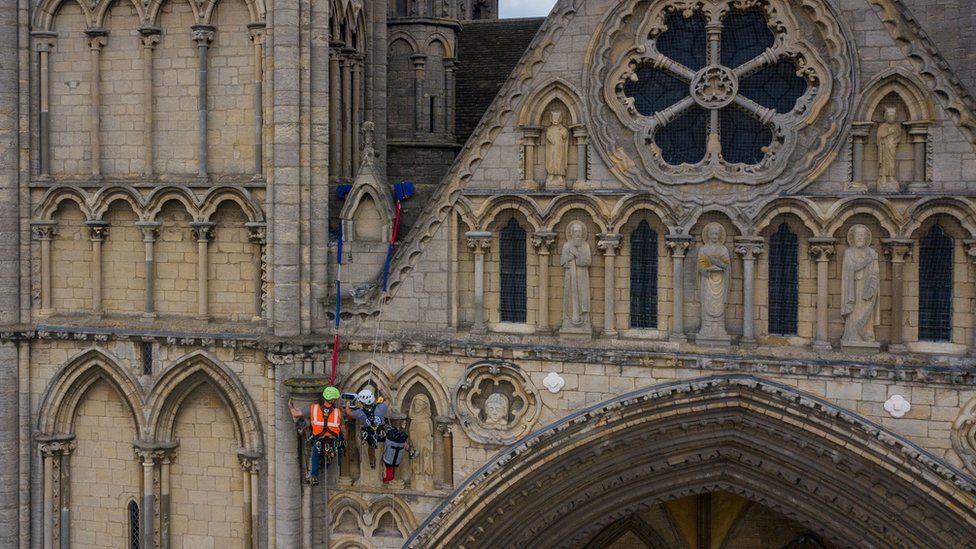 Conservationists abseil Peterborough Cathedral