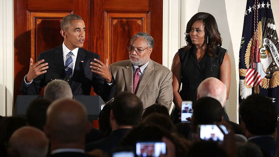 President Barack Obama delivers remarks with Smithsonian National Museum of African American History and Culture Director Lonnie Bunch and first lady Michelle Obama during a reception at the White House on 23 September, 2016