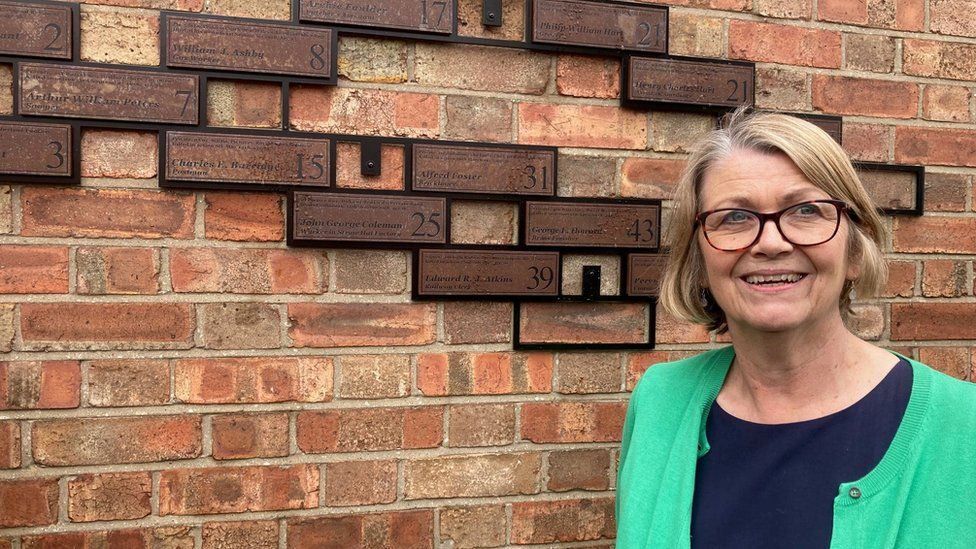 Judy Sutton with the memorial