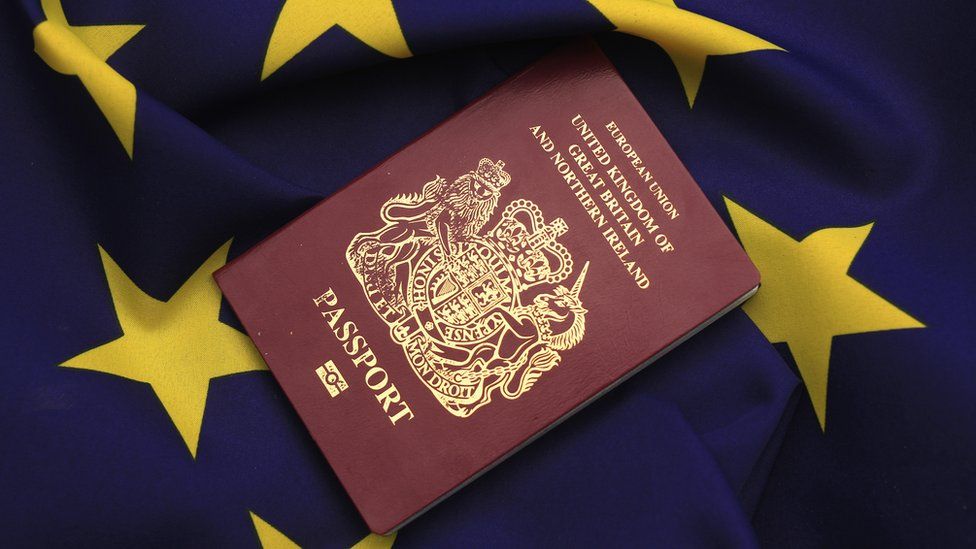 A United Kingdom passport sits on a European Union flag (March 2016)