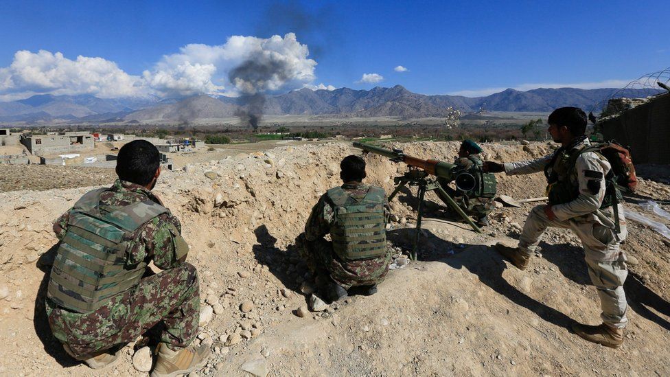 Afghan security forces take position during a gun battle between Taliban and Afghan security forces in Laghman province, Afghanistan