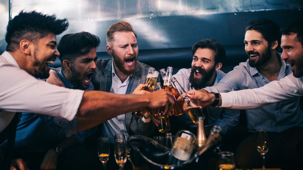 Stock photo of men drinking
