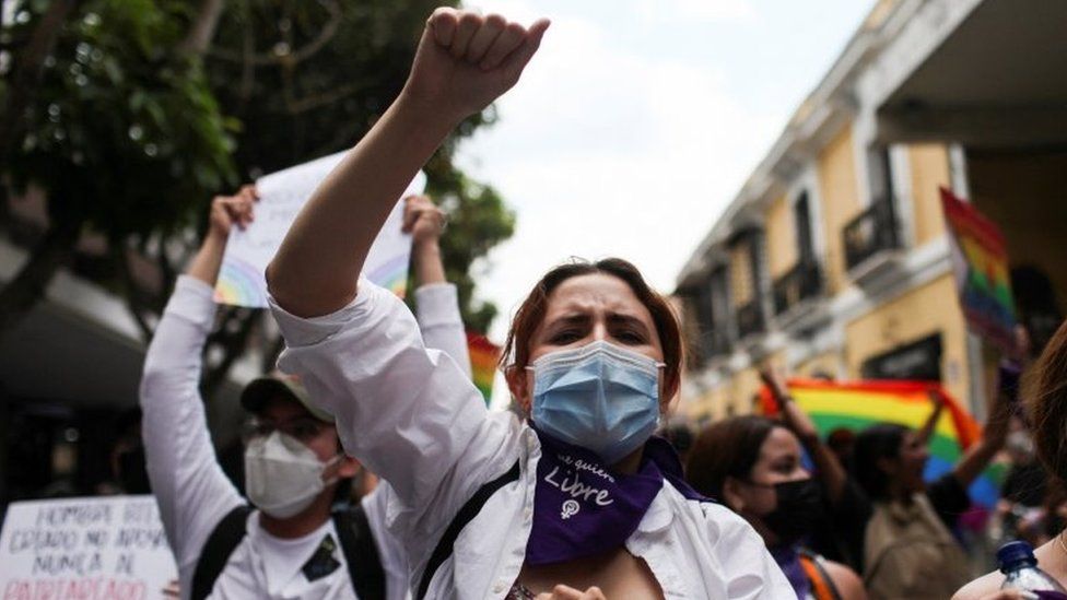People take part in a protest against a law approved by Guatemala's Congress that punishes abortion with prison, prohibits same-sex marriage and teaching about sexual diversity in schools, in Guatemala City, Guatemala March 12, 2022.
